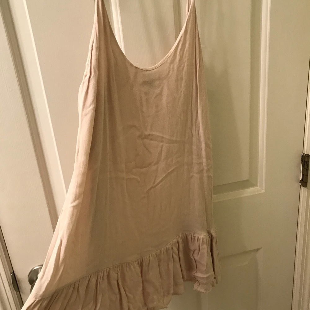 Nude slip dress with ruffle skirt